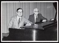 Photograph of Dean Everett Pittman and Assistant Dean Charles Stevens sitting at a piano